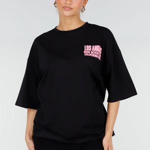 NEW290426 Zwart Oversized T-shirt met Roze Tekst