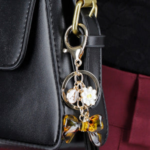 NEW020425 Goudkleurige Tashanger met Leopard Strik