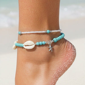 NEW050325 2-Delig Enkelbandjes Set met Blauwe Kraaltjes en Kauri Schelpjes