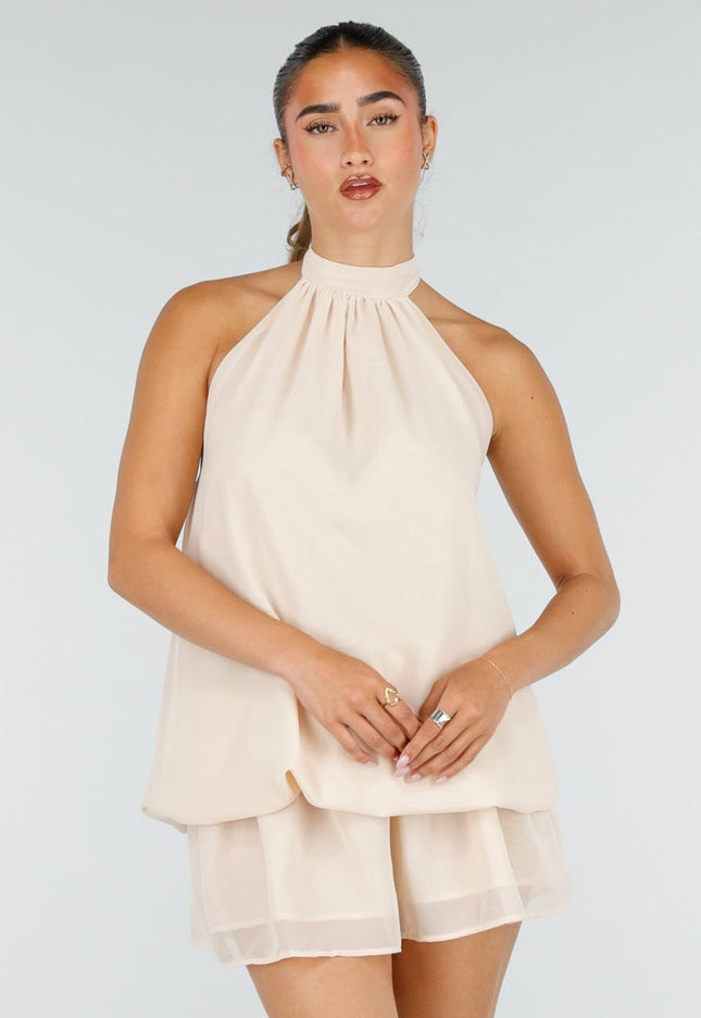 NEW100626 Beige Halter Mini Jurk met Open Rug